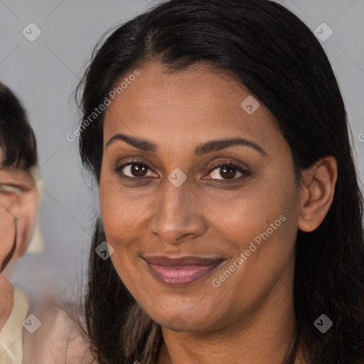 Joyful white adult female with long  brown hair and brown eyes