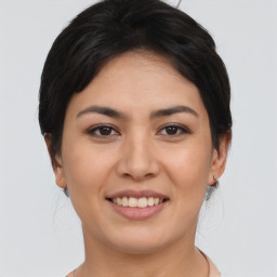 Joyful asian young-adult female with medium  black hair and brown eyes