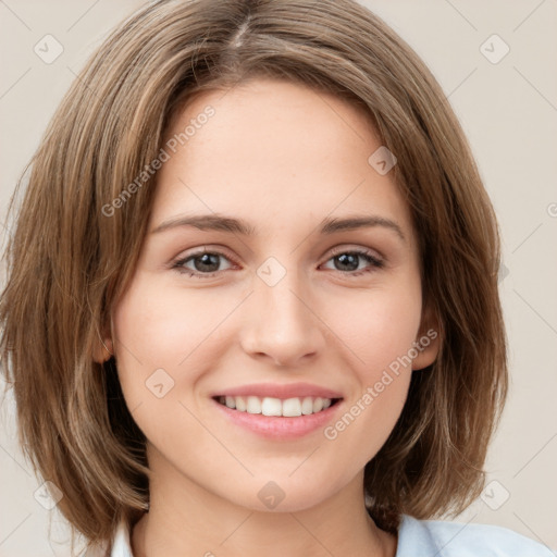 Joyful white young-adult female with medium  brown hair and green eyes