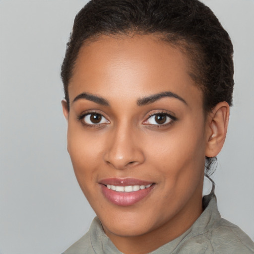 Joyful latino young-adult female with short  brown hair and brown eyes