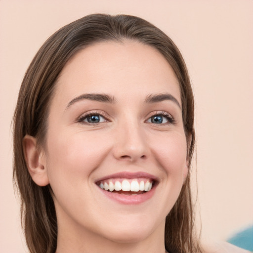 Joyful white young-adult female with medium  brown hair and green eyes