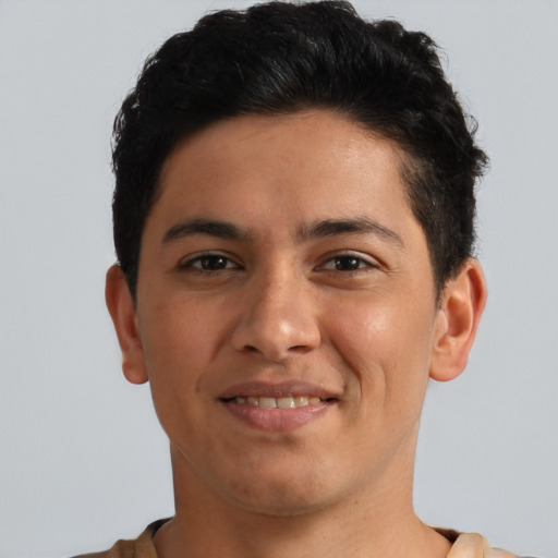 Joyful latino young-adult male with short  brown hair and brown eyes
