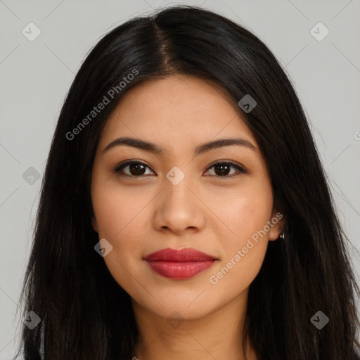 Joyful latino young-adult female with long  brown hair and brown eyes