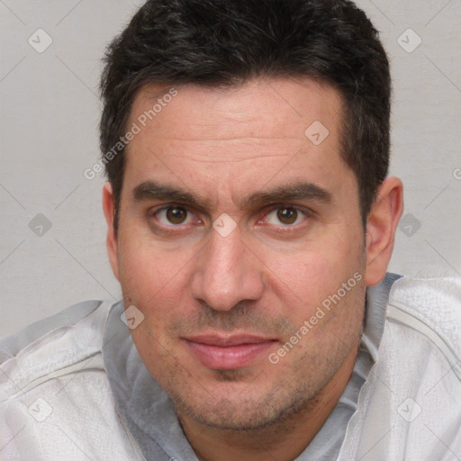 Joyful white adult male with short  brown hair and brown eyes