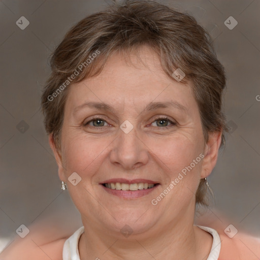 Joyful white adult female with short  brown hair and brown eyes