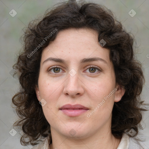 Joyful white adult female with medium  brown hair and green eyes