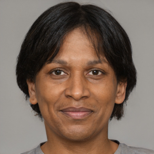 Joyful asian adult male with medium  brown hair and brown eyes