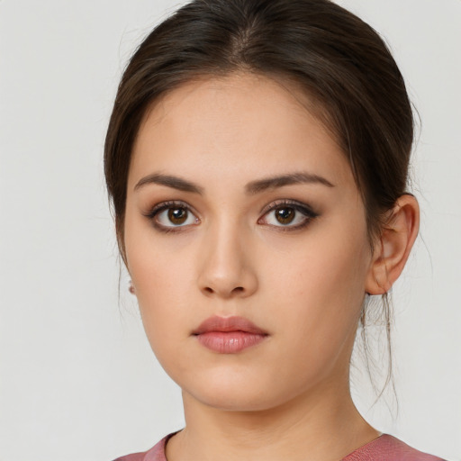 Neutral white young-adult female with medium  brown hair and brown eyes