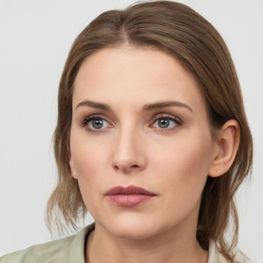 Neutral white young-adult female with medium  brown hair and grey eyes