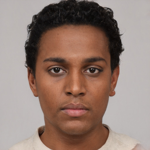 Neutral black young-adult male with short  black hair and brown eyes