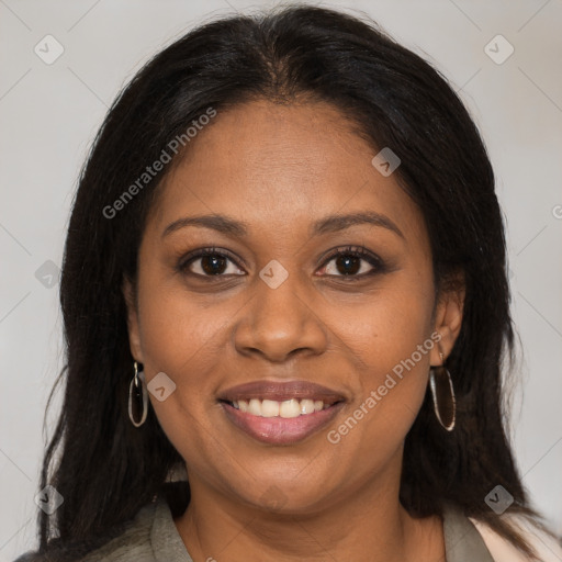 Joyful black adult female with medium  brown hair and brown eyes