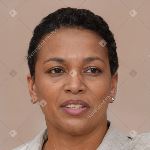 Joyful latino adult female with short  brown hair and brown eyes