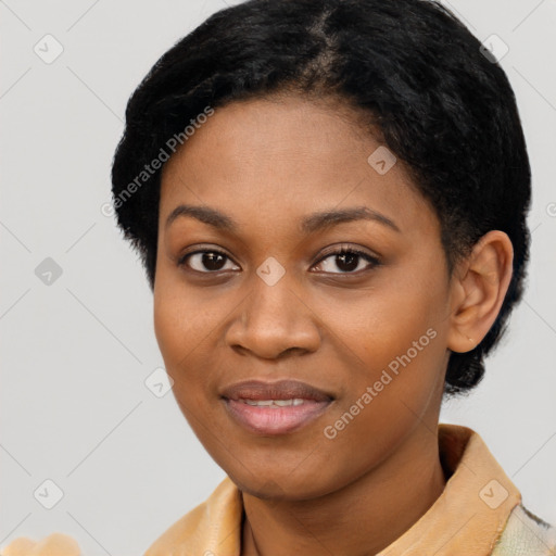 Joyful black young-adult female with short  black hair and brown eyes