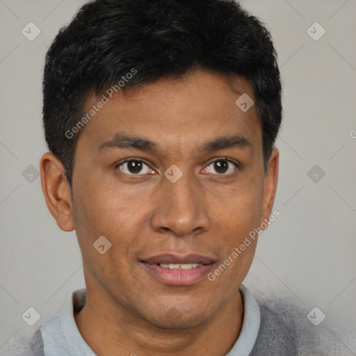 Joyful black young-adult male with short  brown hair and brown eyes