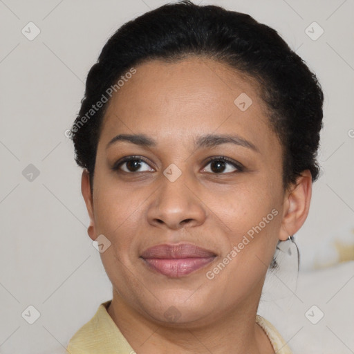 Joyful black adult female with short  brown hair and brown eyes