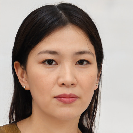 Neutral asian young-adult female with medium  brown hair and brown eyes