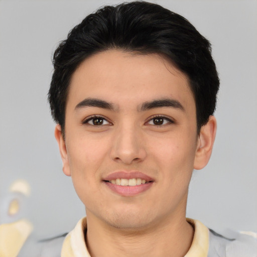 Joyful asian young-adult male with short  brown hair and brown eyes