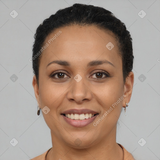 Joyful latino young-adult female with short  black hair and brown eyes