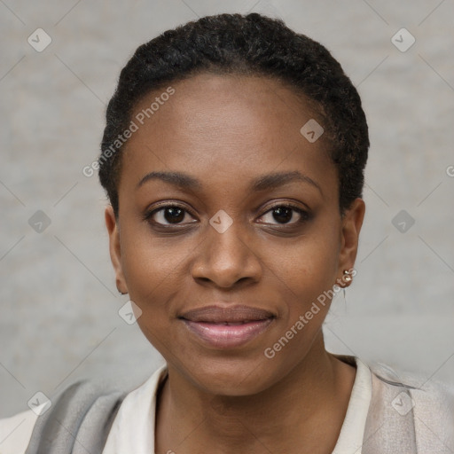 Joyful black young-adult female with short  black hair and brown eyes