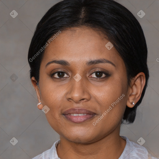 Joyful black young-adult female with medium  brown hair and brown eyes