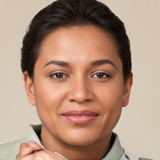 Joyful white young-adult female with short  brown hair and brown eyes