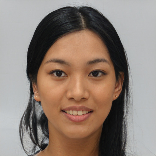 Joyful asian young-adult female with medium  black hair and brown eyes