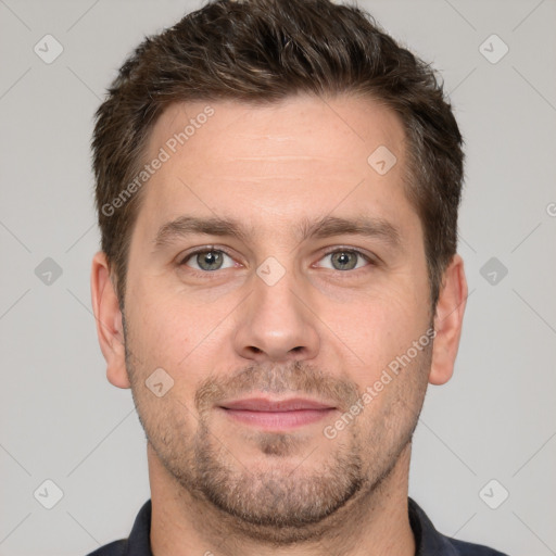 Joyful white adult male with short  brown hair and grey eyes