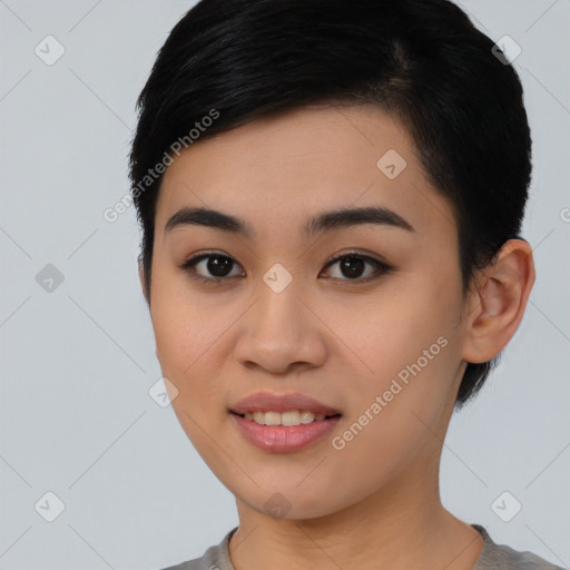 Joyful asian young-adult female with short  black hair and brown eyes