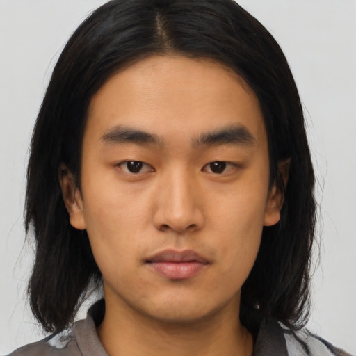 Neutral asian young-adult male with medium  brown hair and brown eyes