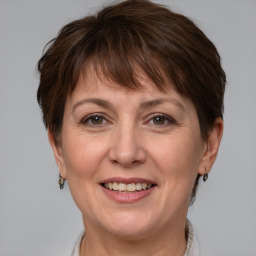 Joyful white adult female with short  brown hair and brown eyes