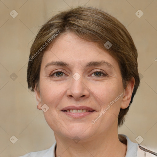 Joyful white adult female with short  brown hair and grey eyes