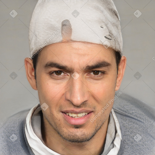 Joyful white adult male with short  black hair and brown eyes