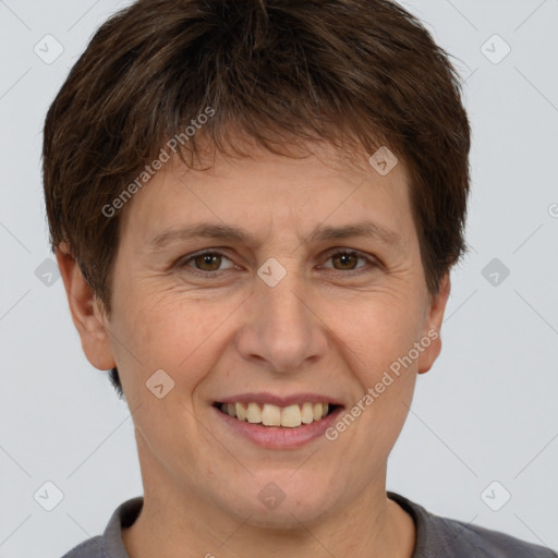 Joyful white adult female with short  brown hair and brown eyes