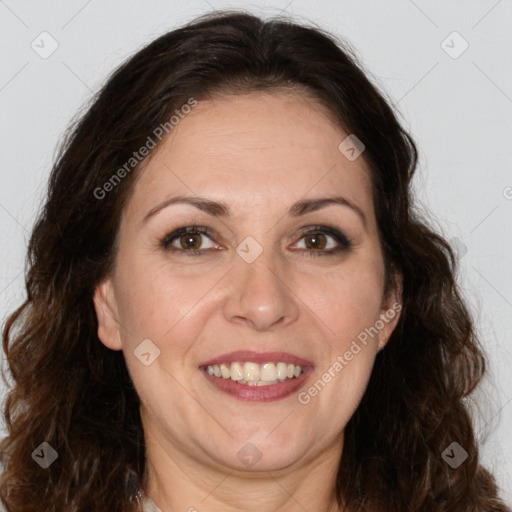 Joyful white adult female with long  brown hair and brown eyes