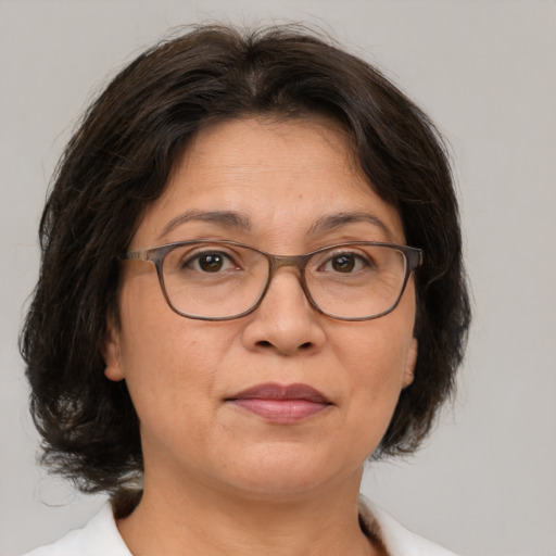 Joyful white adult female with medium  brown hair and brown eyes