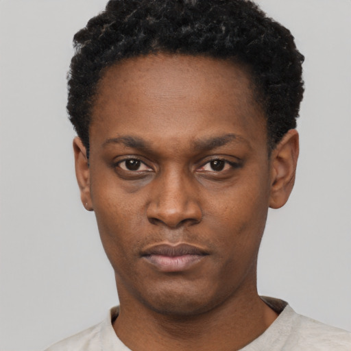Neutral black young-adult female with short  black hair and brown eyes