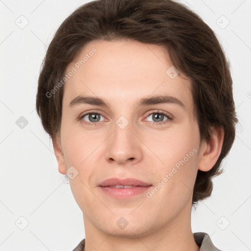 Joyful white young-adult female with short  brown hair and grey eyes