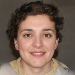 Joyful white young-adult female with medium  brown hair and blue eyes