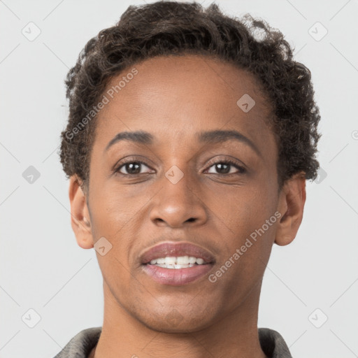 Joyful black young-adult female with short  brown hair and brown eyes