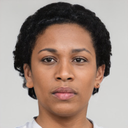 Neutral latino young-adult female with short  black hair and brown eyes