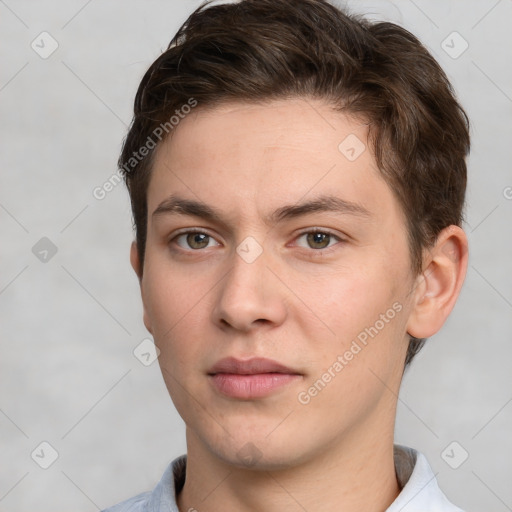 Neutral white young-adult male with short  brown hair and grey eyes