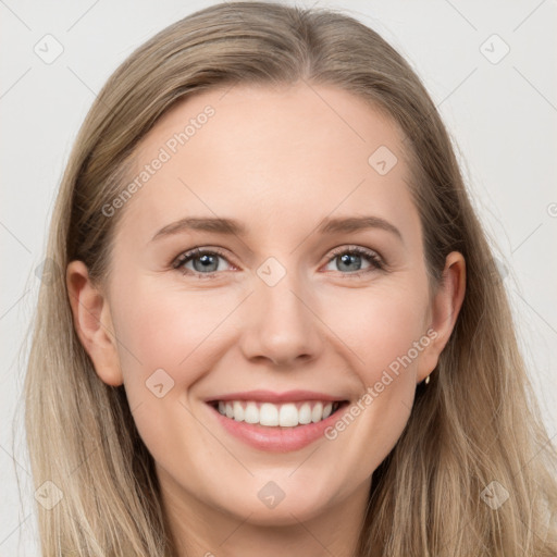 Joyful white young-adult female with long  brown hair and grey eyes