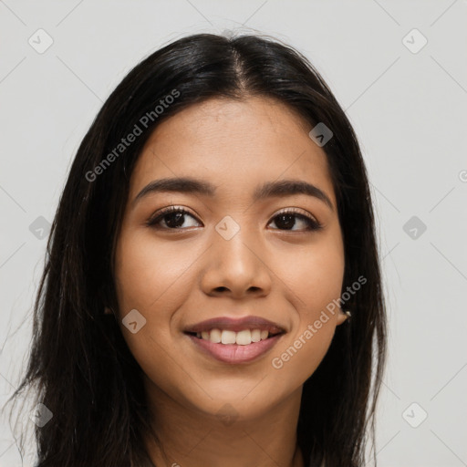 Joyful latino young-adult female with long  brown hair and brown eyes