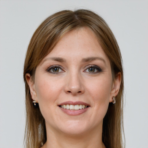 Joyful white young-adult female with long  brown hair and grey eyes