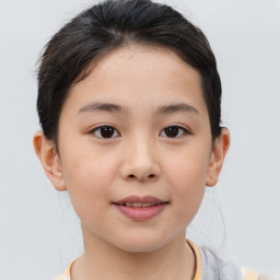Joyful white child female with short  brown hair and brown eyes