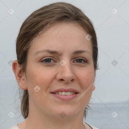 Joyful white young-adult female with medium  brown hair and grey eyes