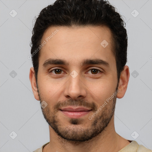 Joyful white young-adult male with short  black hair and brown eyes