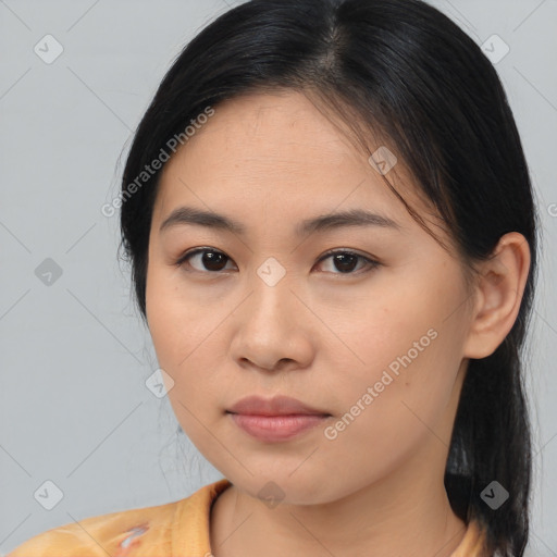 Joyful asian young-adult female with medium  brown hair and brown eyes