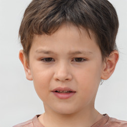 Joyful white child male with short  brown hair and brown eyes