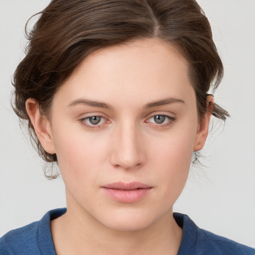 Neutral white young-adult female with medium  brown hair and blue eyes